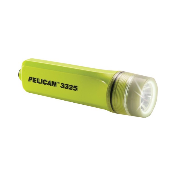 A Pelican 3325 flashlight in high-visibility yellow-green, shown with its front lens illuminated against a plain white background.